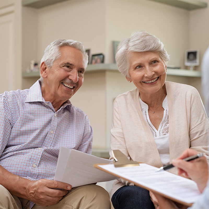 retired couple meeting with wealth management professional